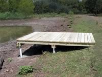 Pier built on private pond with 3 in. PVC pipe for post 8' x 12'
