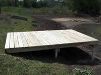 Pier built on private pond with 3 in. PVC pipe for post 8' x 12'