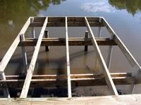 Pier built on private pond with 3in. PVC pipe for post 8' x 26'