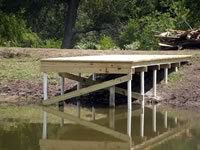 Pier built on private pond with 3in. PVC pipe for post 8' x 26'