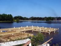 Pier built on private pond with 3 in. PVC pipe for post