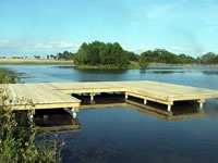 Pier built on private pond with 3 in. PVC pipe for post