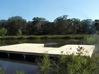 Pier built on private pond with 3 in. PVC pipe for post