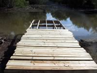 Pier built on private pond with 3in. PVC pipe for post 8' x 26'